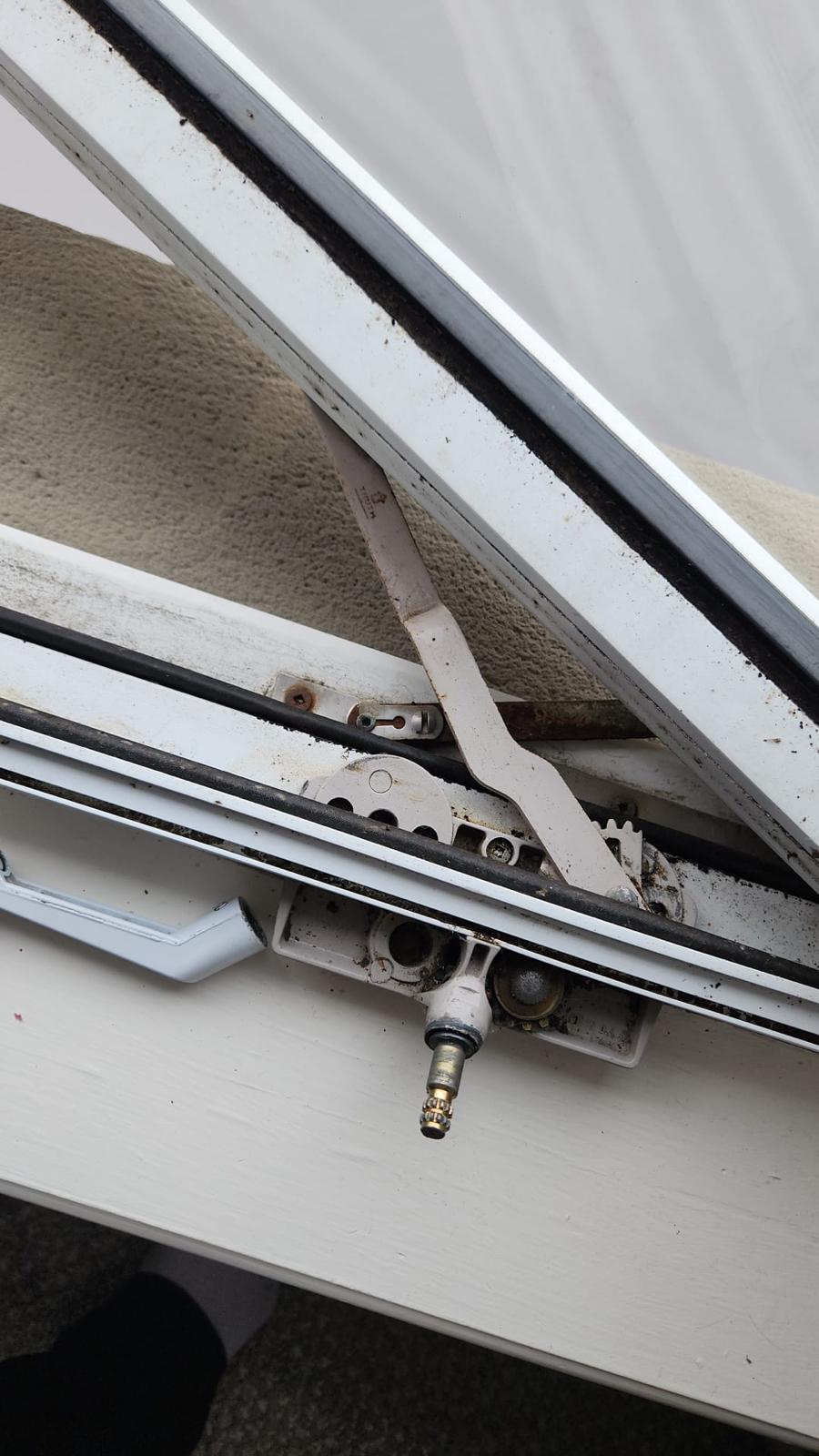 Old worn-out window crank mechanism - rusted and broken